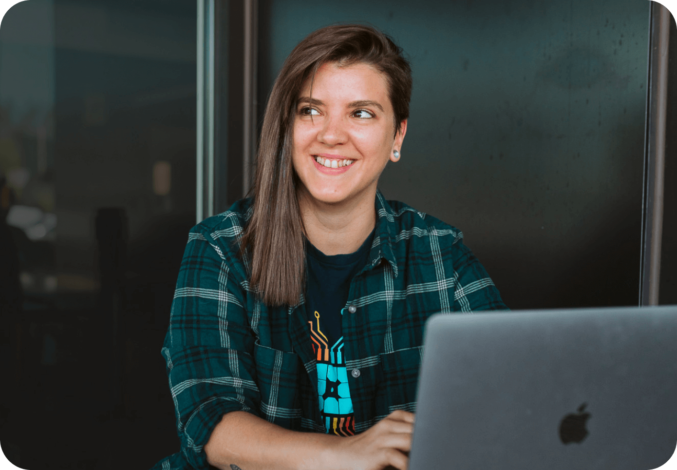 page speed boost hero woman smiling at laptop