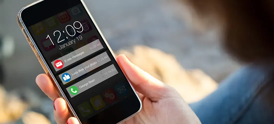 User looking at push notifications on a smart phone