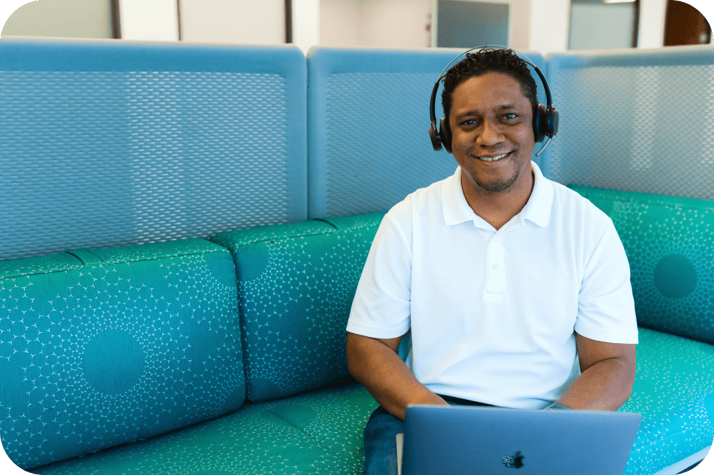 WordPress customer support man with headset at laptop